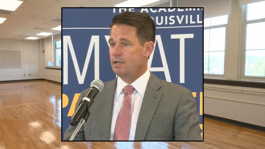 Dr. Marty Pollio against backdrop of Academy @ Shawnee renovations