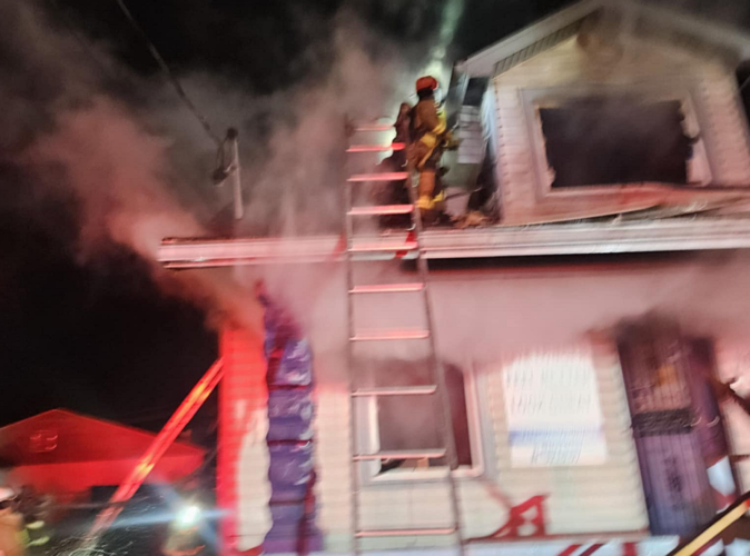 Shively firefighters on roof of burning home
