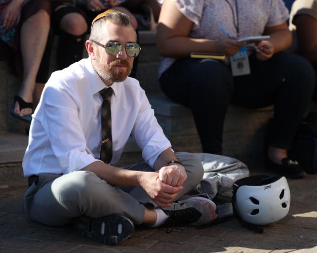 Man listens during vigil.JPG