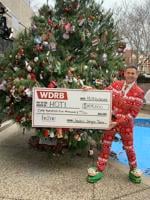 IMAGES | Jude's Jingle Tree 2023 presents big check to to the Home of the Innocents