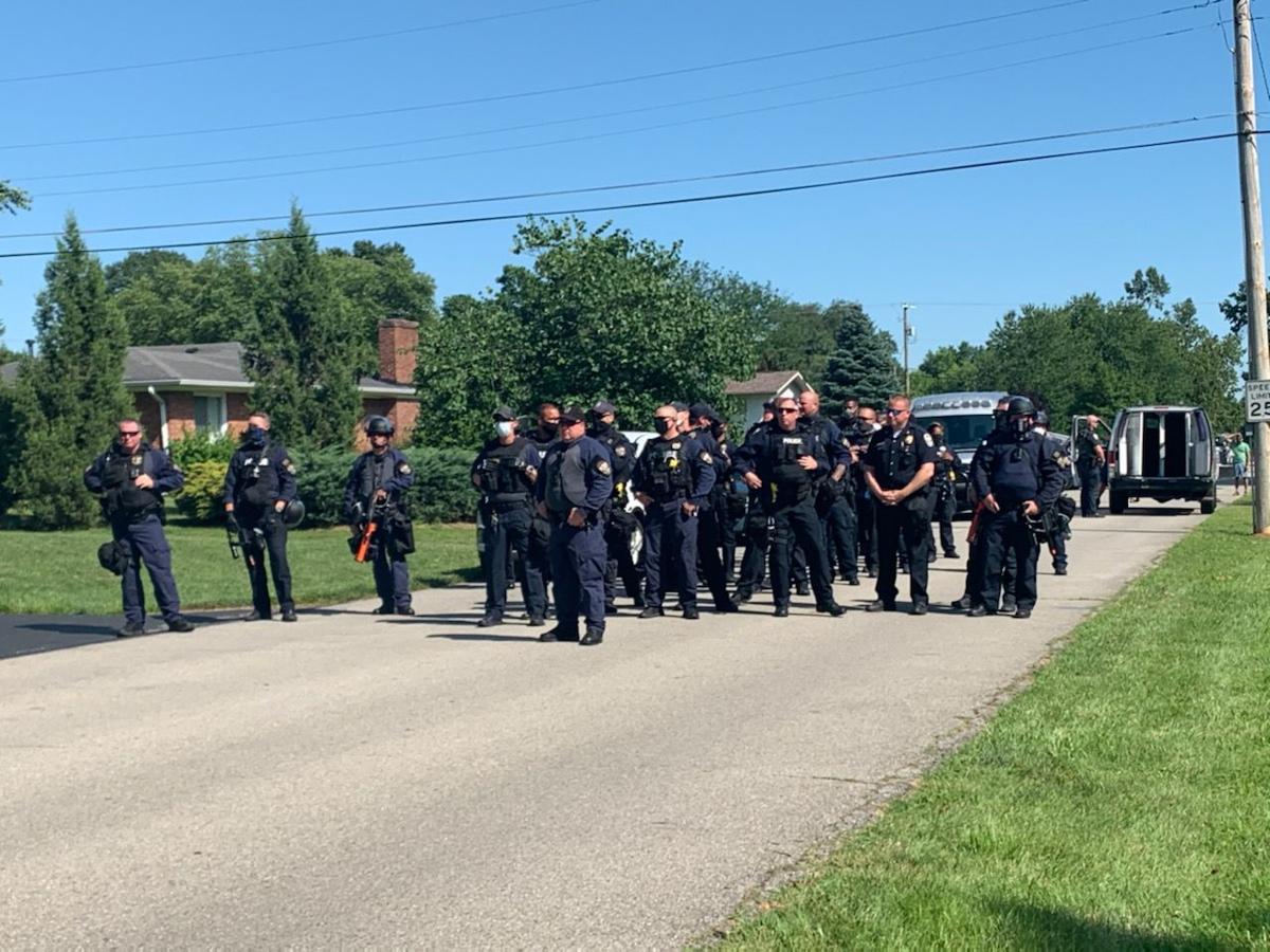 Police in east Louisville stand to meet Breonna Taylor protesters on Tuesday, July 14, 2020