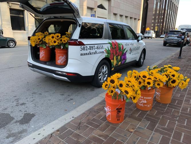 Local florist pays it forward by giving sunflowers away for free