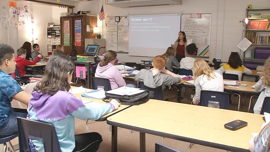 Students and teacher in school classroom (generic)