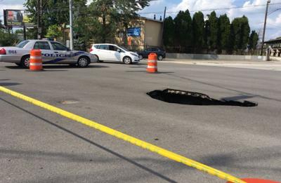 Sinkhole opens up at busy Louisville intersection