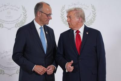 Trump greets Germany's Chancellor Friedrich Merz in Egypt at Gaza summit