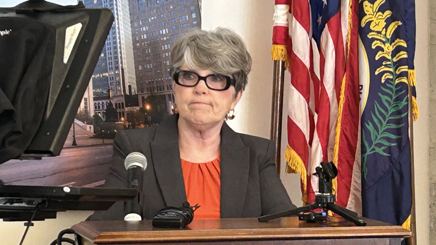 PVA administrator Colleen Younger at podium