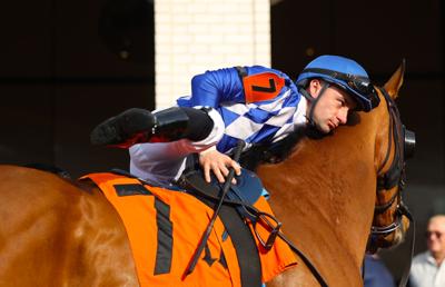 Jockey rises on the horse.JPG