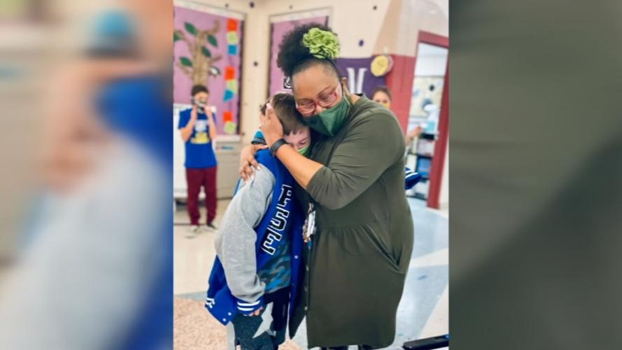 Shelby County student hugs teacher.jpeg