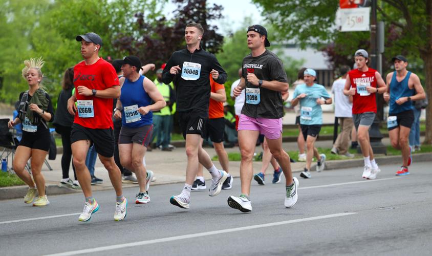 People run in marathon on Broadway.JPG