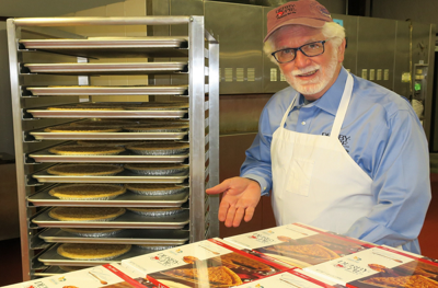 Alan Scott Rupp stands near finished Derby Pies at Kern's Kitchen in Louisville, Ky.