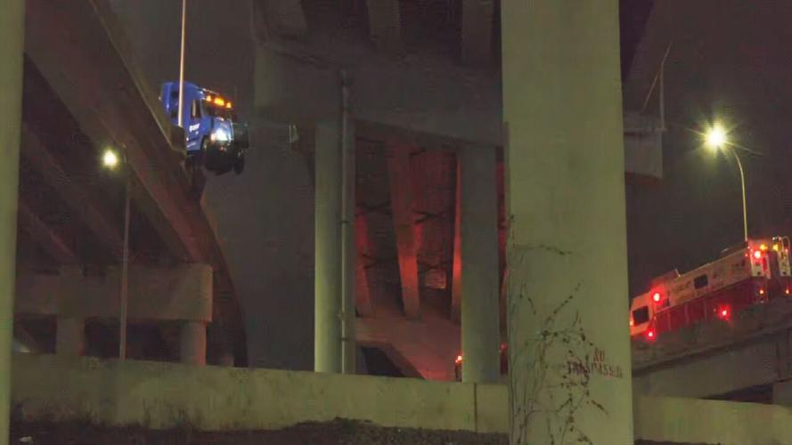 Semi dangles from I-65 ramp after jackknifing