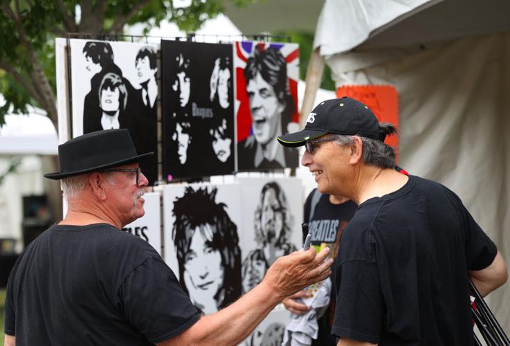 Artists shows off paintings at Abbey Road on the River.JPG