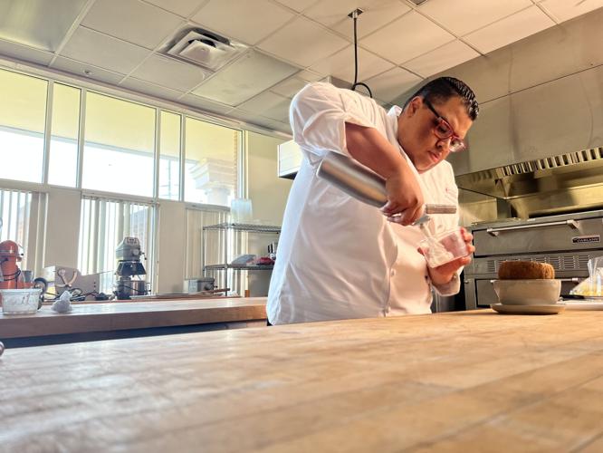 Sullivan University Chef Representative Domonic Tardy makes coconut dessert