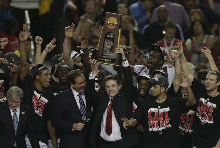 Louisville players and Rick Pitino celebrate.jpg