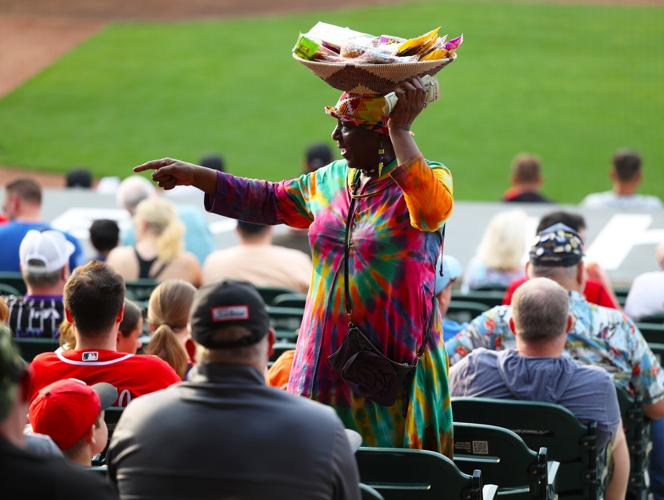 Elizabeth Kizito sells a cookie.JPG