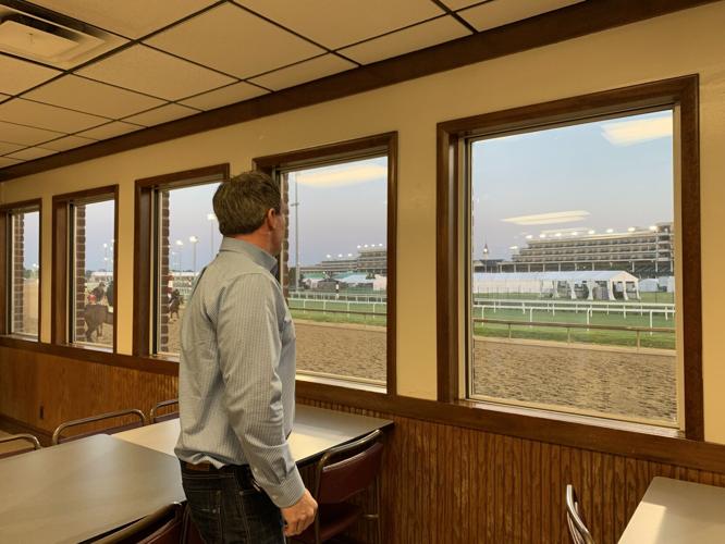 Lee Wagner looks out Track kitchen windows.jpg