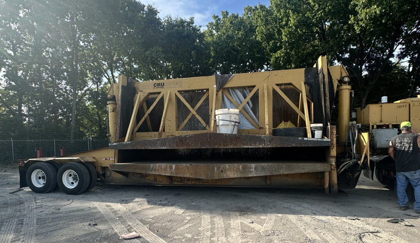 Vehicle crushing apparatus at LMPD impound lot