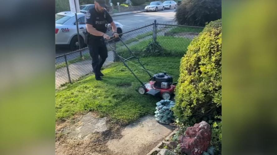 officer mows yard 4