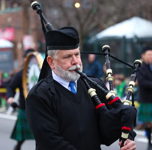 Man plays bag pipe at St. Patrick's Day Parade.JPG