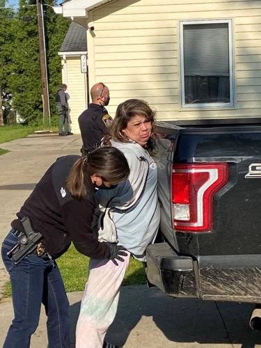 Amanda Cea being patted down by officer.jpg