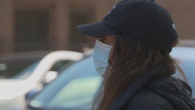 Woman wearing a mask to protest against COVID-19