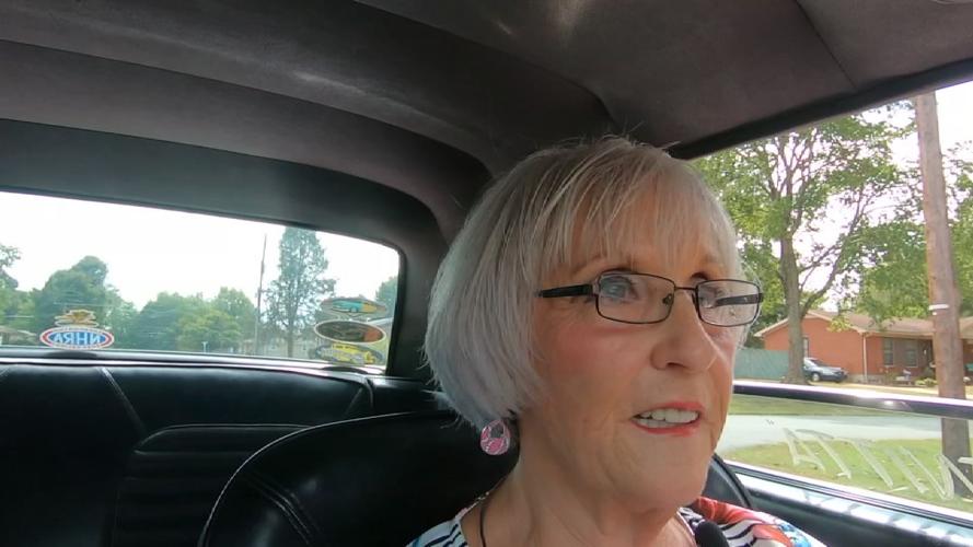 Benitta Russell driving her race car, Tickle Pink