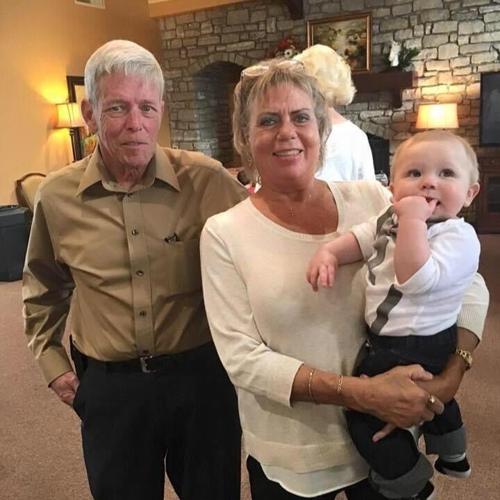 Rick Morgan and his wife Sherry with their grandchild