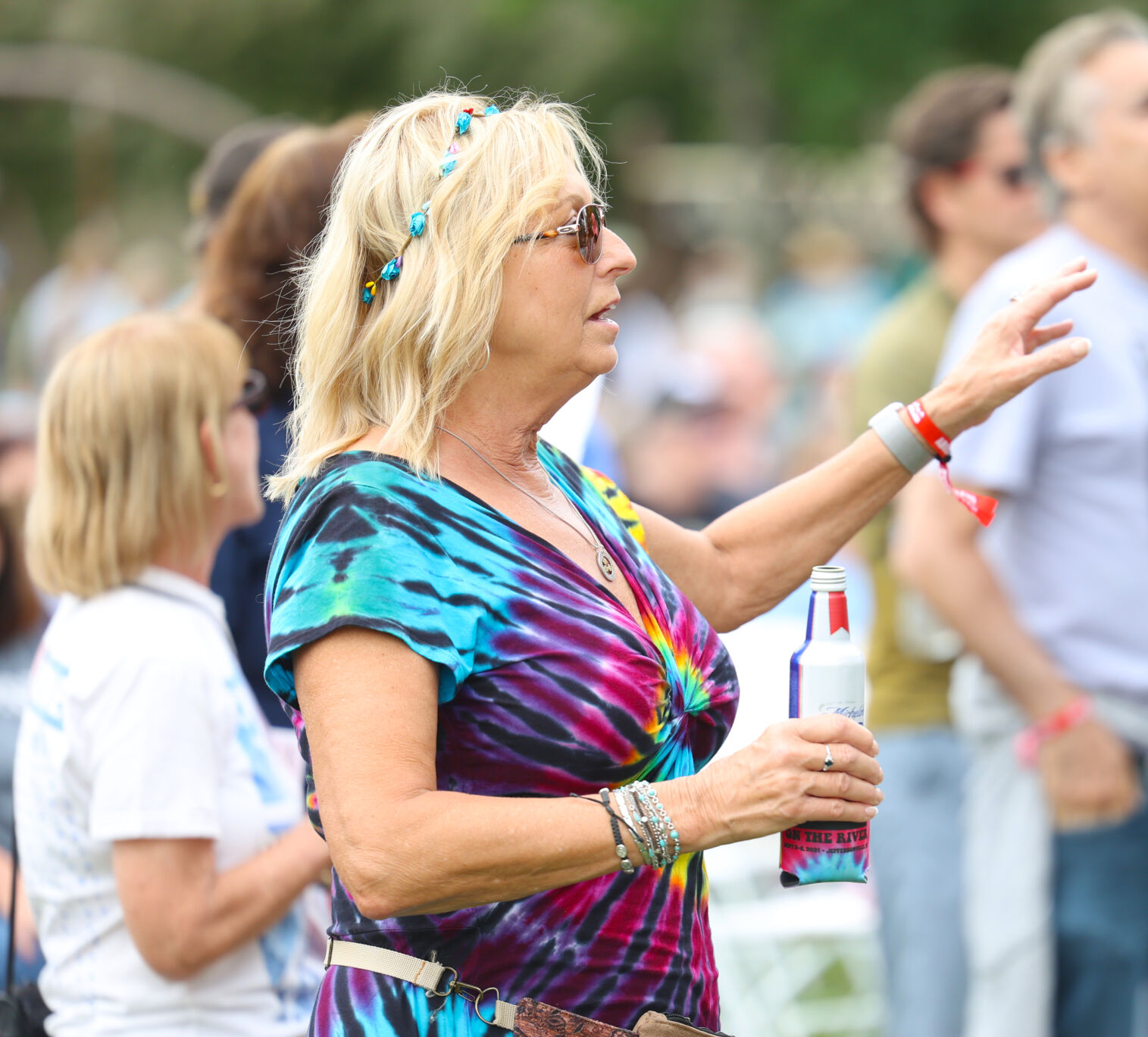 Woman sings along at Abbey Road on the River.JPG