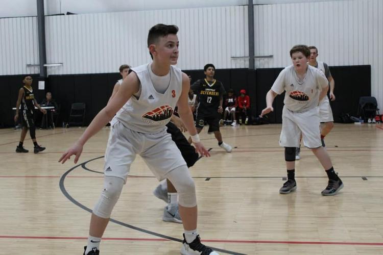 Brycen plays defense during basketball game