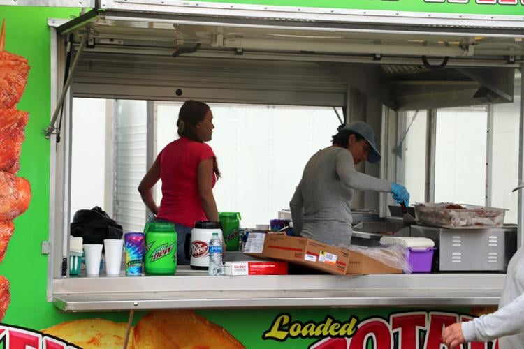 Crews set up booths along the Ohio River one day before Thunder Over Louisville 2023