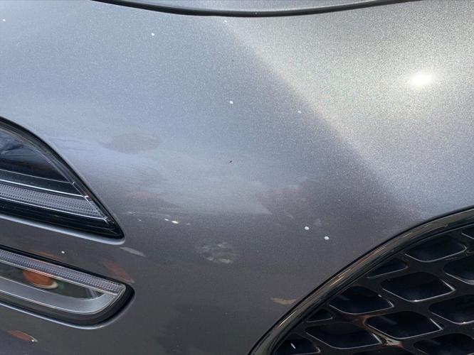 Spatter from paint that dripped from the Sherman Minton Bridge onto Mike Scheser's car