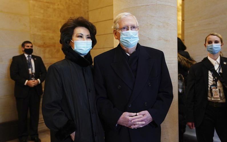 Senate Majority Leader Mitch McConnell, right, and his wife, former Secretary of Transportation Elaine Chao