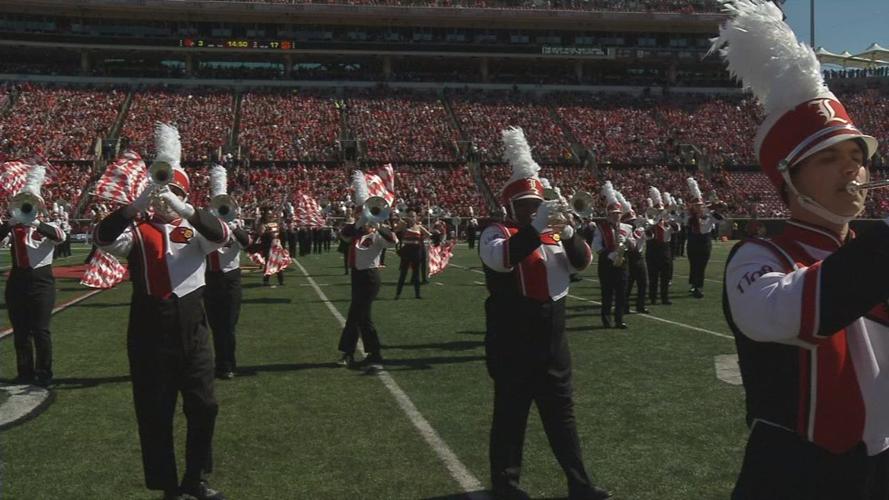 4-year-old boy with Down syndrome leads Cardinal Marching Band during halftime performance
