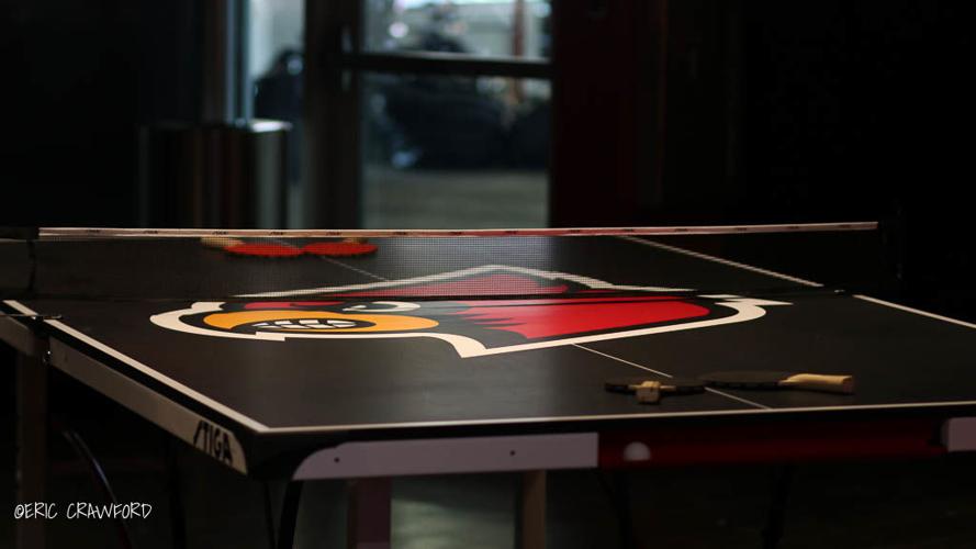 Louisville football players lounge ping pong table