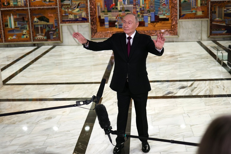 Vladimir Putin speaks to journalists in Moscow