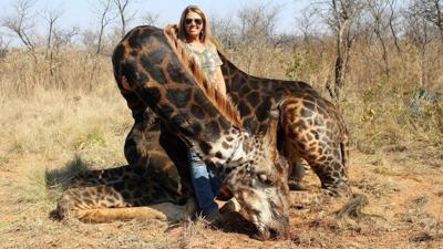 Ky. game hunter's images of her black giraffe 'trophy kill' spark outrage