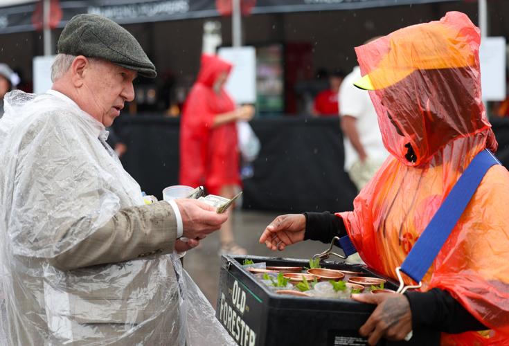 Man pays vendor for drink - Churchill Downs.JPG