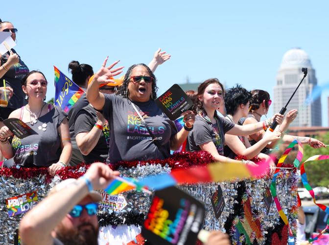 Cheers with skyline at Kentuckiana Pride Parade