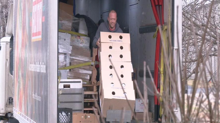Volunteers unload Christmas gifts