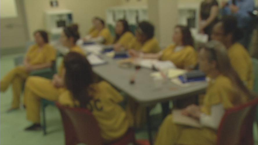 Inmates in jail (generic, blurred)