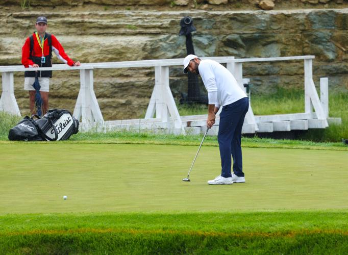 Scottie Scheffler putts on the 13th green.JPG