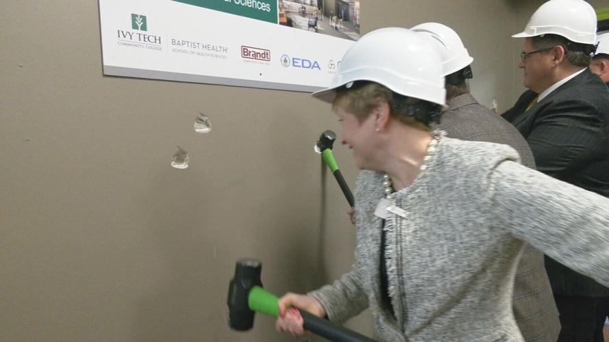 Ivy Tech Sellersburg staff members swing sledgehammers to launch remodeling project