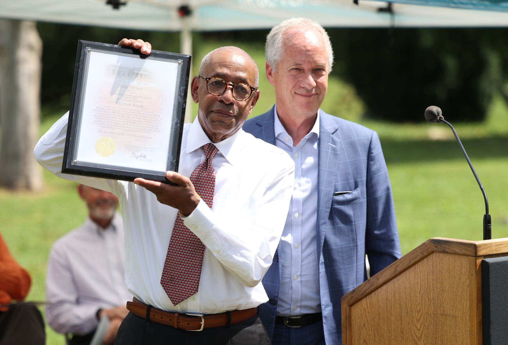 Billy Snow holds up proclamation