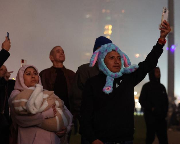 Man records fireworks with his phone.JPG