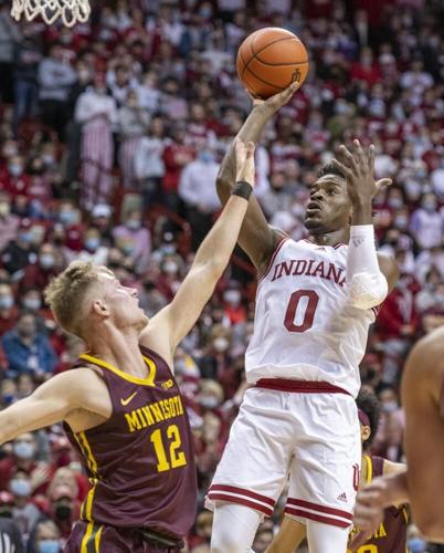 Indiana guard Xavier Johnson puts up a shot over the defense of Minnesota.jpeg
