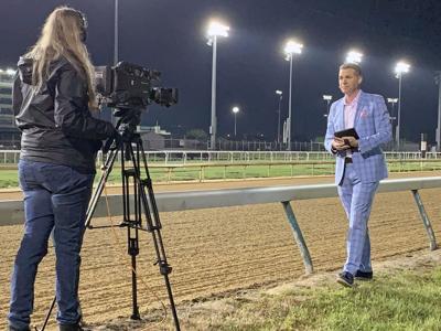 Camera Operator Katherine Vieth and Meteorologist Jude Redfield at the Churchill Downs Backside