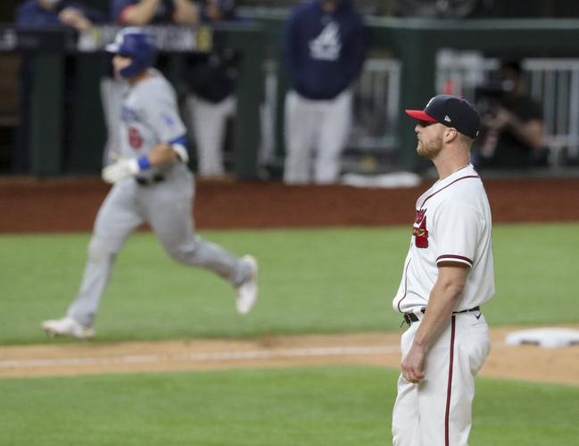 Atlanta Braves relief pitcher Will Smith, right, reacts after giving up a three-run home run to Los Angeles Dodgers catcher Will Smith