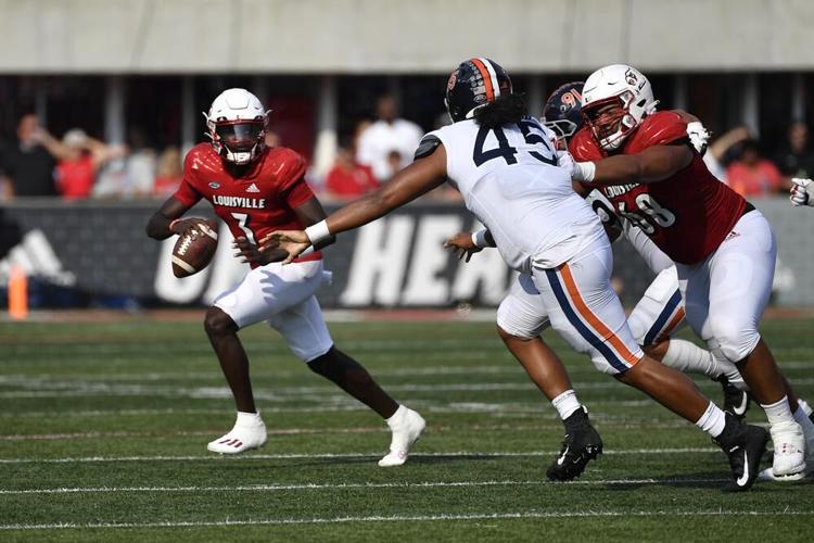 Malik Cunningham forced to scramble against Virginia.jpeg