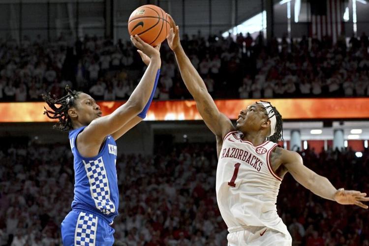 Arkansas guard JD Notae blocks a shot by Kentucky guard TyTye Washington.jpeg