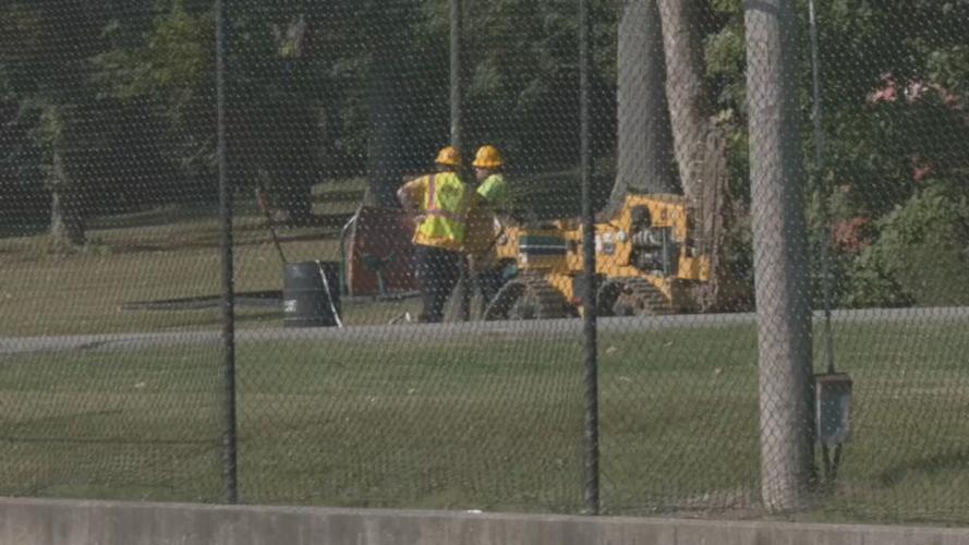 Iroquois Park tennis courts with construction workers nearby